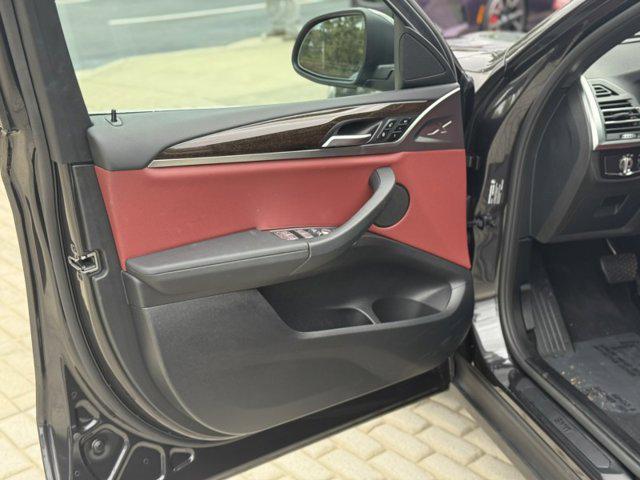 used 2024 BMW X4 car, priced at $49,990