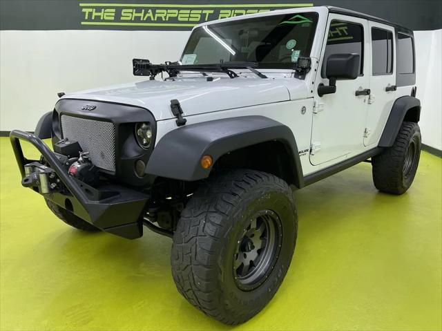 used 2013 Jeep Wrangler Unlimited car, priced at $18,988