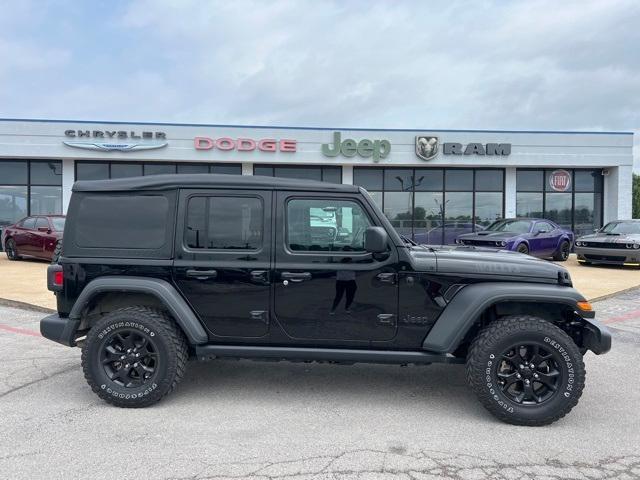 used 2021 Jeep Wrangler Unlimited car, priced at $33,128