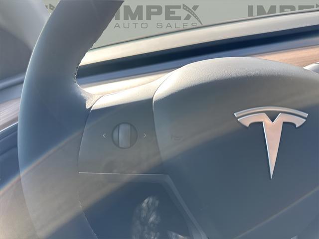 used 2025 Tesla Model Y car, priced at $40,450