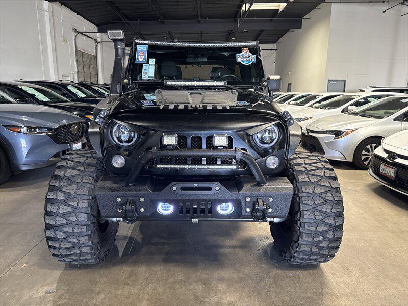 used 2014 Jeep Wrangler Unlimited car, priced at $16,950