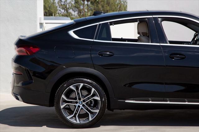 used 2022 BMW X6 car, priced at $58,988