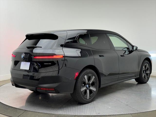 used 2025 BMW iX car, priced at $64,900