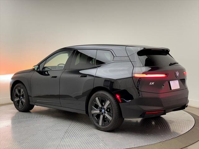 used 2025 BMW iX car, priced at $64,900