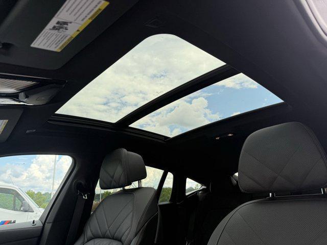 used 2025 BMW X6 car, priced at $66,498