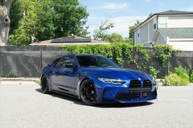 used 2024 BMW M4 car, priced at $89,999