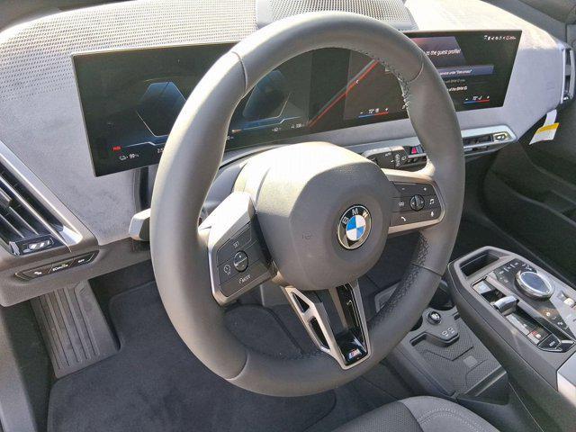 new 2026 BMW iX car, priced at $100,870