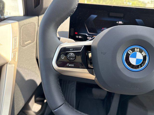 new 2025 BMW iX car, priced at $97,475