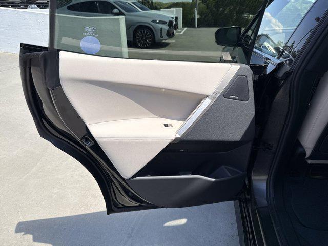 new 2025 BMW iX car, priced at $97,475