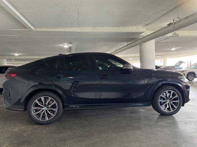 used 2022 BMW X6 car, priced at $64,097