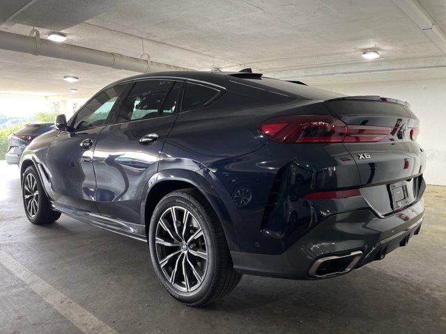 used 2022 BMW X6 car, priced at $64,097