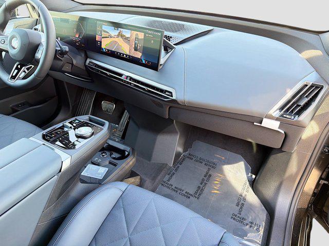 new 2026 BMW iX car, priced at $93,925