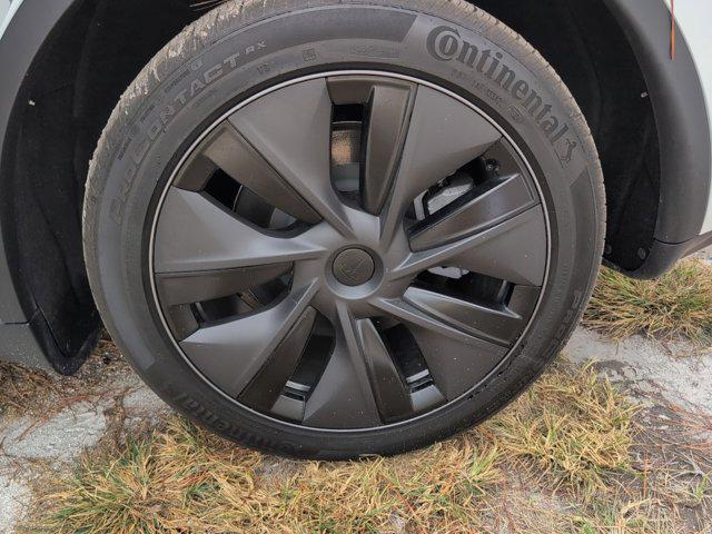 used 2025 Tesla Model Y car, priced at $37,472