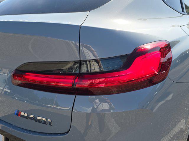 used 2025 BMW X4 car, priced at $57,999