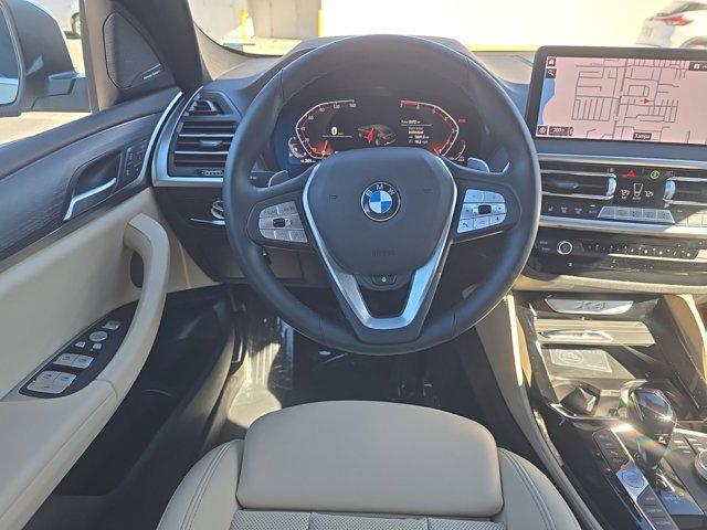 used 2024 BMW X4 car, priced at $54,627