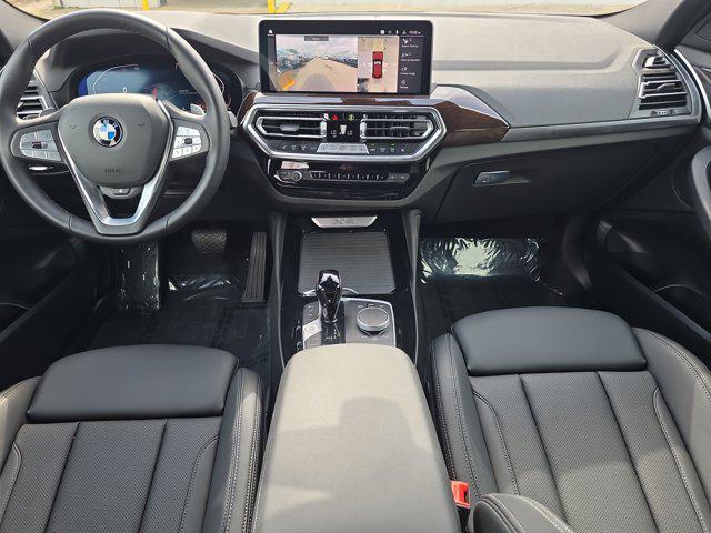 used 2025 BMW X4 car, priced at $53,448