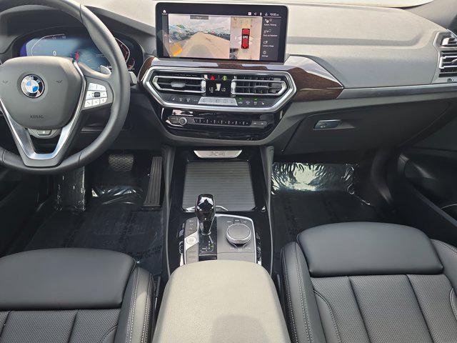used 2025 BMW X4 car, priced at $53,448
