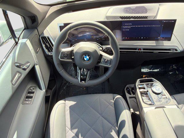 new 2026 BMW iX car, priced at $92,325
