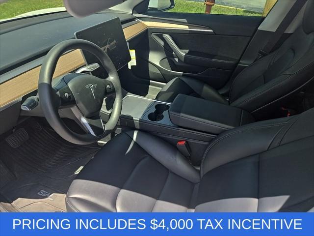 used 2023 Tesla Model 3 car, priced at $21,000