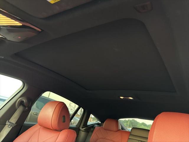 used 2024 BMW X6 car, priced at $59,900