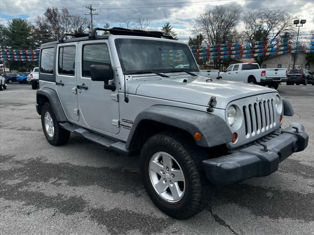 used 2011 Jeep Wrangler Unlimited car, priced at $14,354