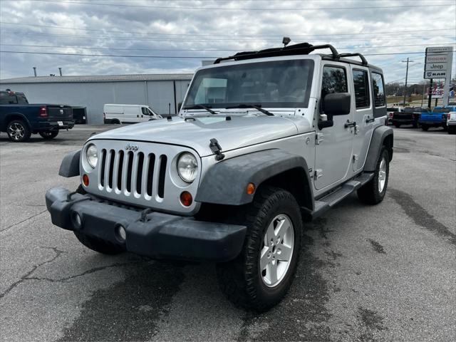 used 2011 Jeep Wrangler Unlimited car, priced at $14,354