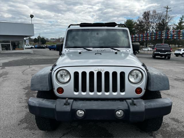 used 2011 Jeep Wrangler Unlimited car, priced at $14,354