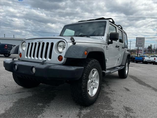 used 2011 Jeep Wrangler Unlimited car, priced at $14,354