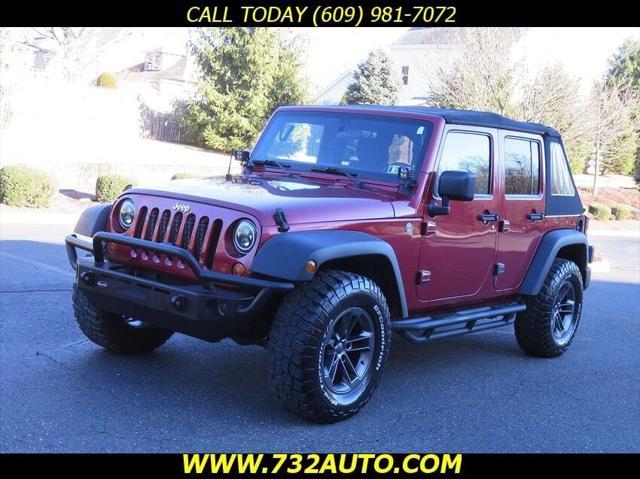 used 2011 Jeep Wrangler Unlimited car, priced at $10,900