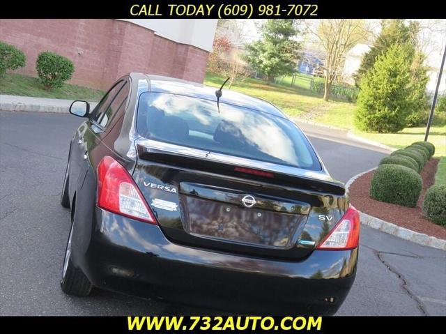 used 2013 Nissan Versa car, priced at $5,900