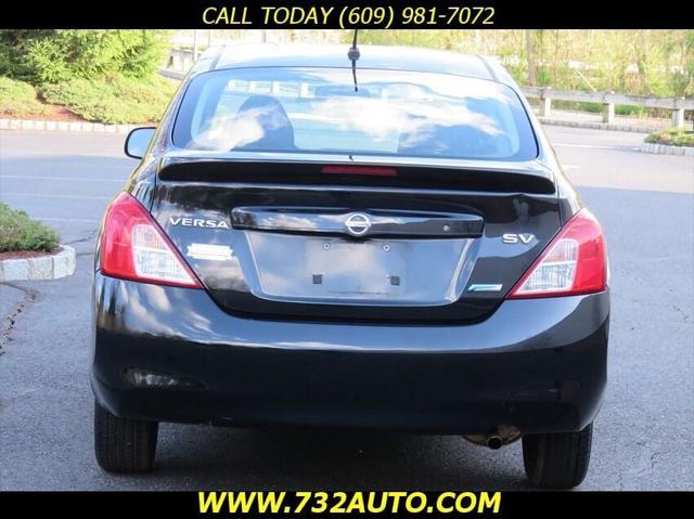 used 2013 Nissan Versa car, priced at $5,900