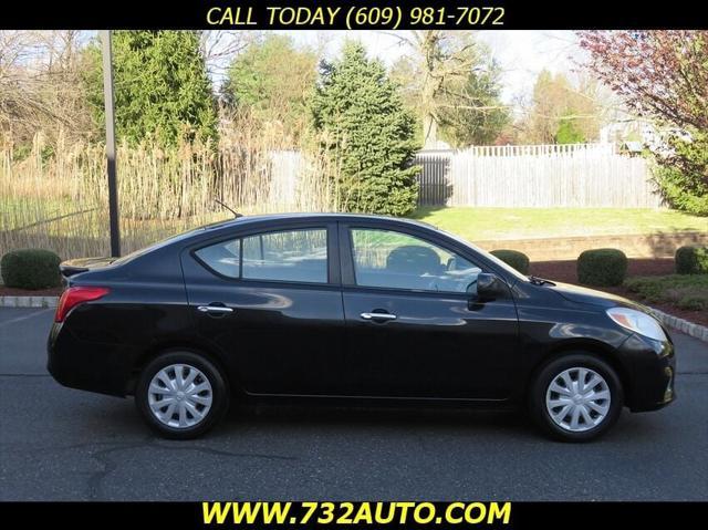 used 2013 Nissan Versa car, priced at $5,900