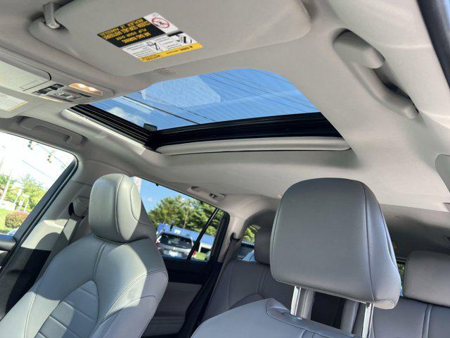 used 2021 Toyota Highlander Hybrid car, priced at $32,885