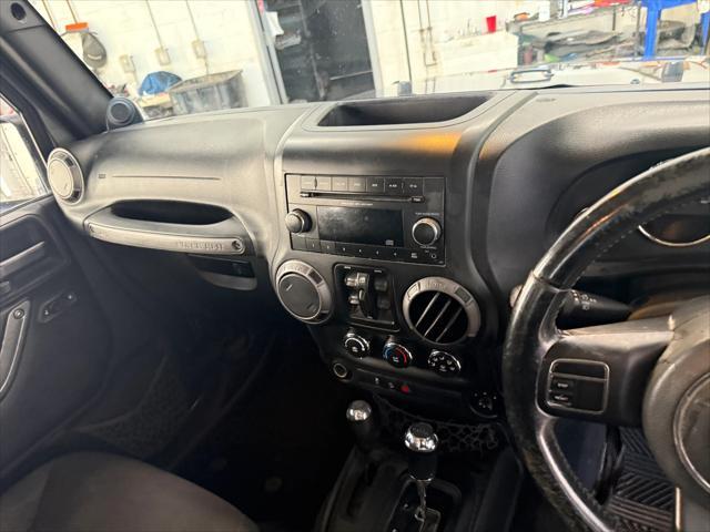 used 2014 Jeep Wrangler Unlimited car, priced at $19,221