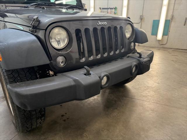 used 2014 Jeep Wrangler Unlimited car, priced at $19,221