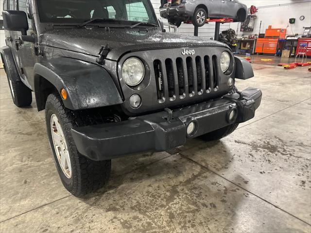 used 2014 Jeep Wrangler Unlimited car, priced at $19,378