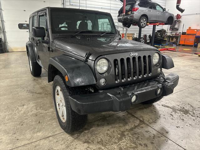 used 2014 Jeep Wrangler Unlimited car, priced at $19,378