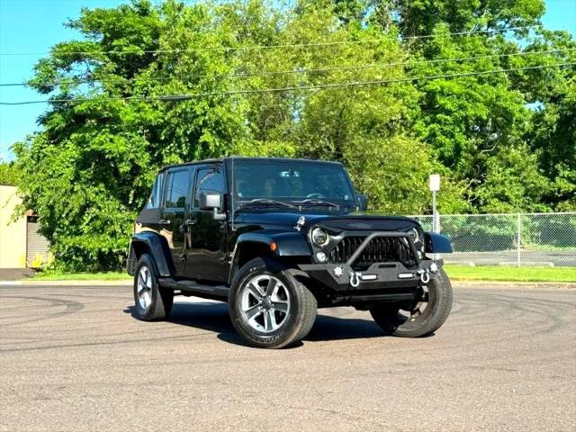 used 2014 Jeep Wrangler Unlimited car, priced at $17,395