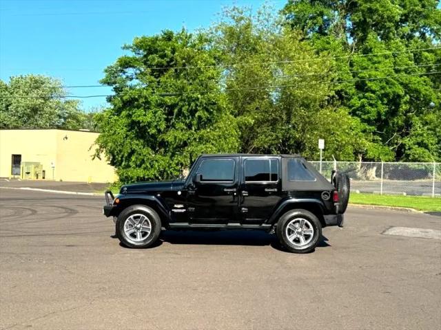 used 2014 Jeep Wrangler Unlimited car, priced at $17,395