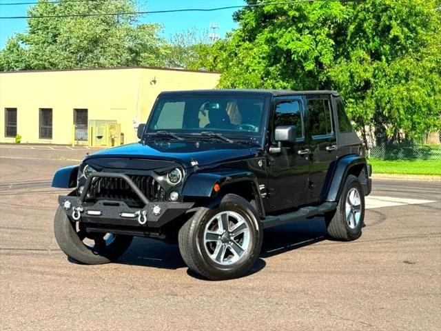 used 2014 Jeep Wrangler Unlimited car, priced at $17,395