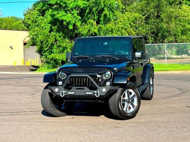 used 2014 Jeep Wrangler Unlimited car, priced at $17,395