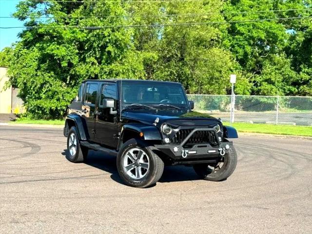 used 2014 Jeep Wrangler Unlimited car, priced at $17,395