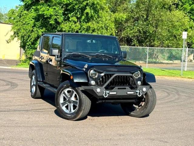 used 2014 Jeep Wrangler Unlimited car, priced at $17,395