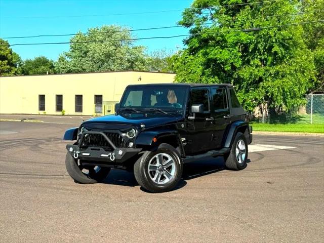 used 2014 Jeep Wrangler Unlimited car, priced at $17,395