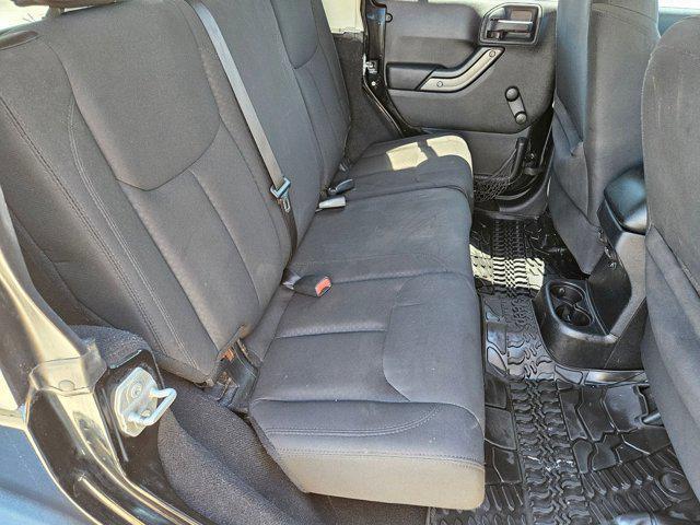 used 2015 Jeep Wrangler Unlimited car, priced at $19,056