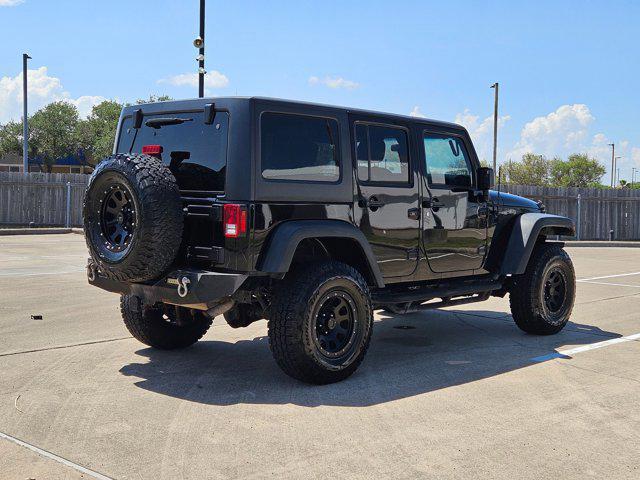 used 2015 Jeep Wrangler Unlimited car, priced at $19,056