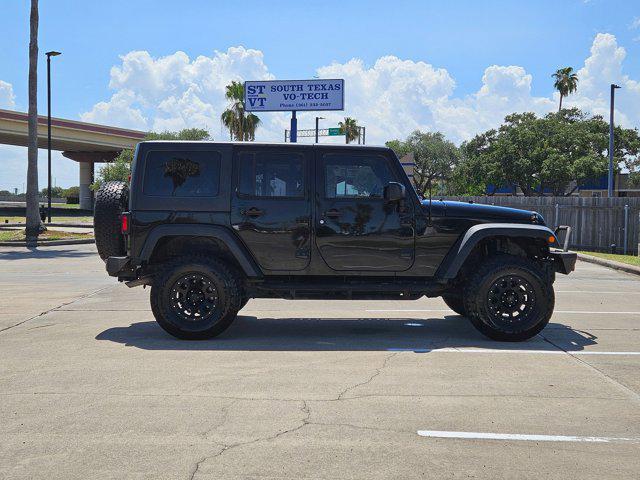 used 2015 Jeep Wrangler Unlimited car, priced at $19,056