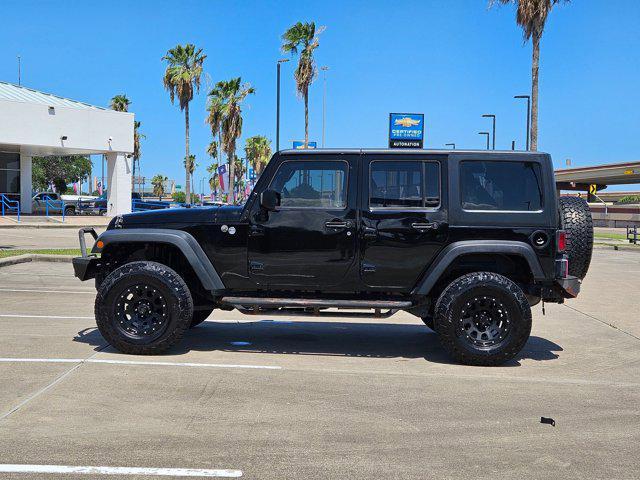 used 2015 Jeep Wrangler Unlimited car, priced at $19,056