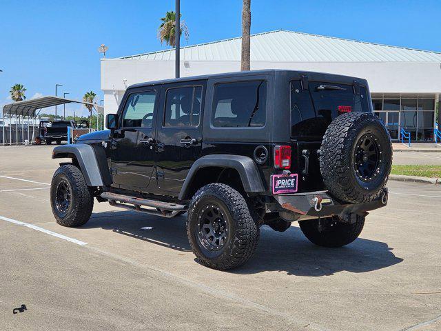 used 2015 Jeep Wrangler Unlimited car, priced at $19,056
