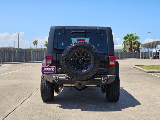 used 2015 Jeep Wrangler Unlimited car, priced at $19,056